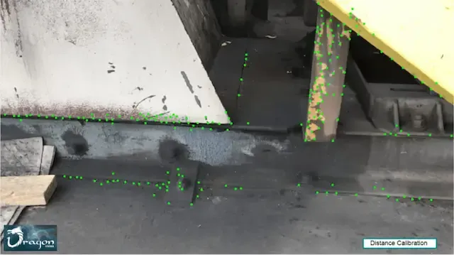 Video frame with identified target measurement points and static reference zones for motion comparison