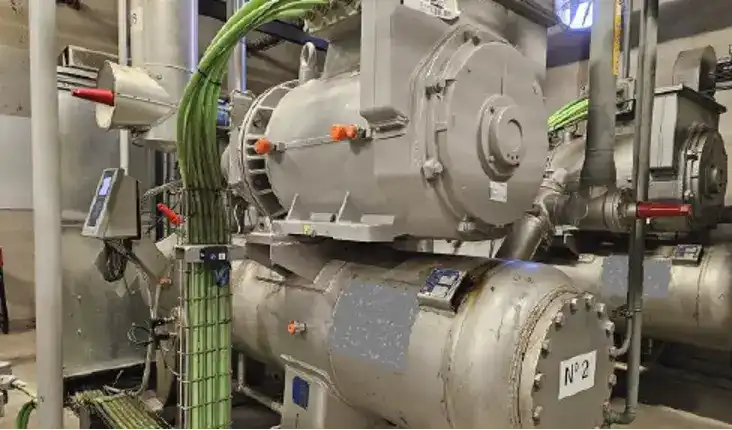 Industrial refrigeration compressor room at a food logistics center