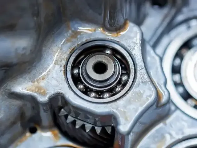 Damaged bearing showing wear and failure in rotating machinery, one of the most common machine faults