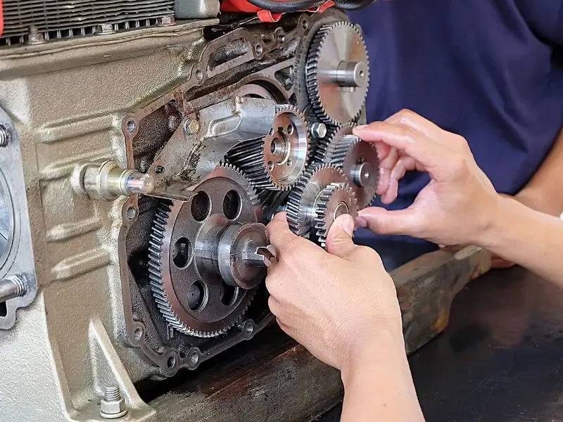 Damaged gearbox showing worn gear teeth caused by gear failure in a gear-driven mechanical system